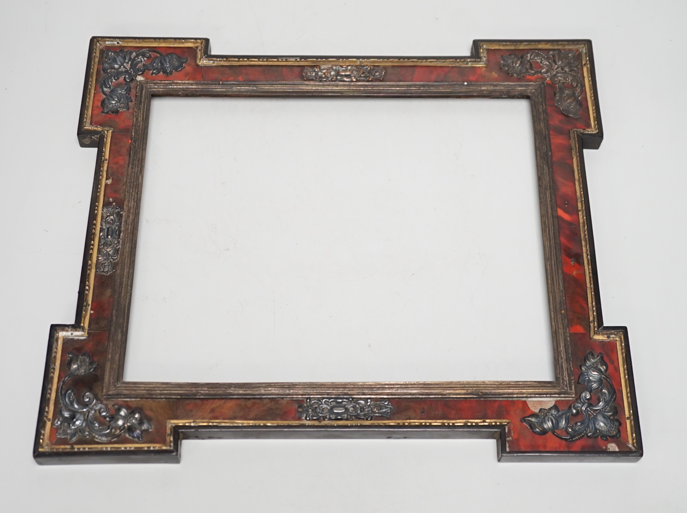 A 19th century red tortoiseshell and metal mounted picture frame. 27 x 31cm